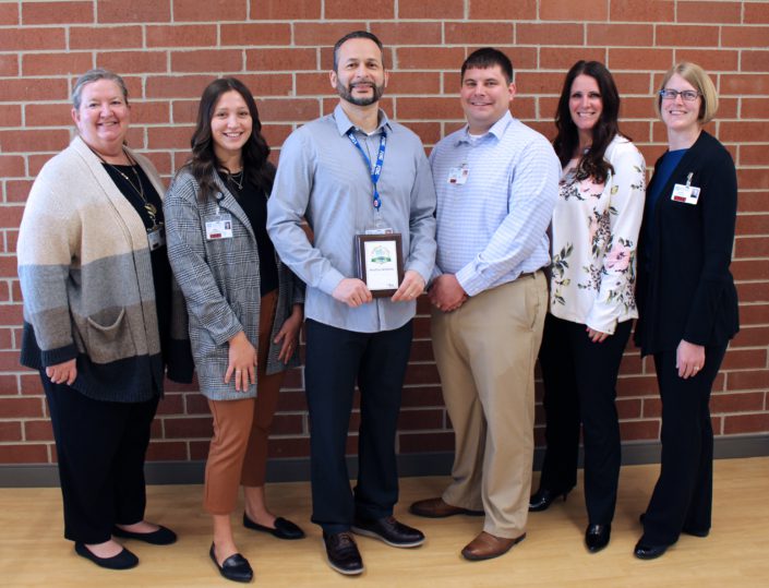 Worksite Award winners holding the Worksite Award